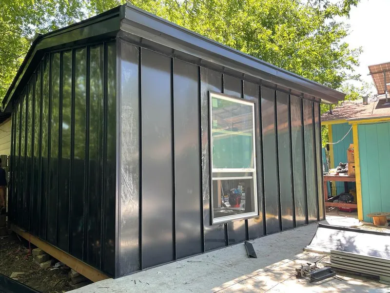 Black standing seam metal wall panels for Roof Inspection in Timberlane