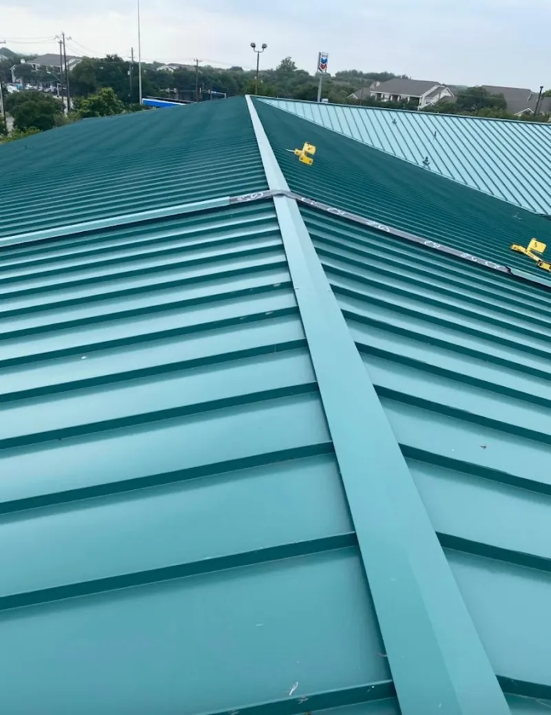 Green commercial metal roof ridge and valley for Metal Roof Repair in Timberlane
